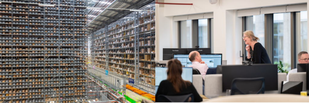 Image of large, fully stocked warehouse alongside people working at computers in a logistics hub.